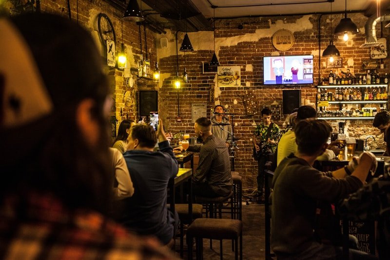 Warm pub interior with customers using WiFi